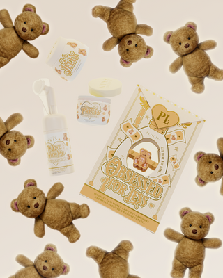 Image of the P.Louise Teddy Coconut Cake Obsessed For Less skincare set surrounded by teddy bears on a pink background
