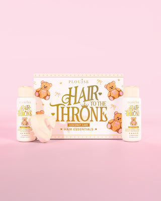 P.Louise Hair to the Throne hair essentials set with the coconut cake shampoo, conditioner and scalp massager on a pink background