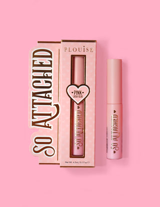 P.Louise So Attached Lash Glue product packaging and the glue tube itself, placed against a pink background.