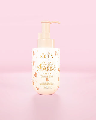 Bottle of the P.Louise You Must Be Soaking bath oil in coconut cake against a pink background